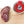 Load image into Gallery viewer, An up close picture of black truffle salami cut into slices on a cutting board next to a jar of black truffle salt.

