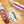 Load image into Gallery viewer, Two chubs of salami, one in packaging with "saucisson sec" written on it and the other cut into slices, on a cutting board with salt, peppercorns and garlic powder between them.
