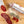 Load image into Gallery viewer, Two chubs of salami, one in packaging with "Spanish Chorizo" written on it and the other cut into slices, on a wood cutting board with herbs and spices between them.
