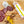 Load image into Gallery viewer, A product photo of il porcellino salumi's Lemongrass Szechuan Peppercorn Salami shot from above. A chub of salami is on a cutting board next to salami slices, packaged salami, herbs and spices.
