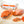 Load image into Gallery viewer, 'nduja salami on a cutting board with a spoon in the salami to show how soft it is.
